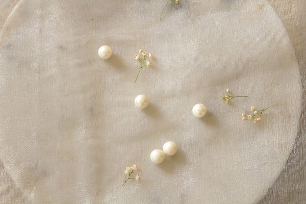 Natural pearls on linen