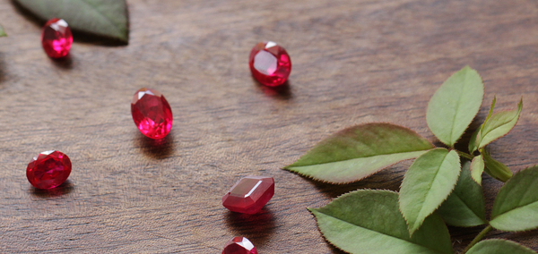 Natural rubies on a wooden table